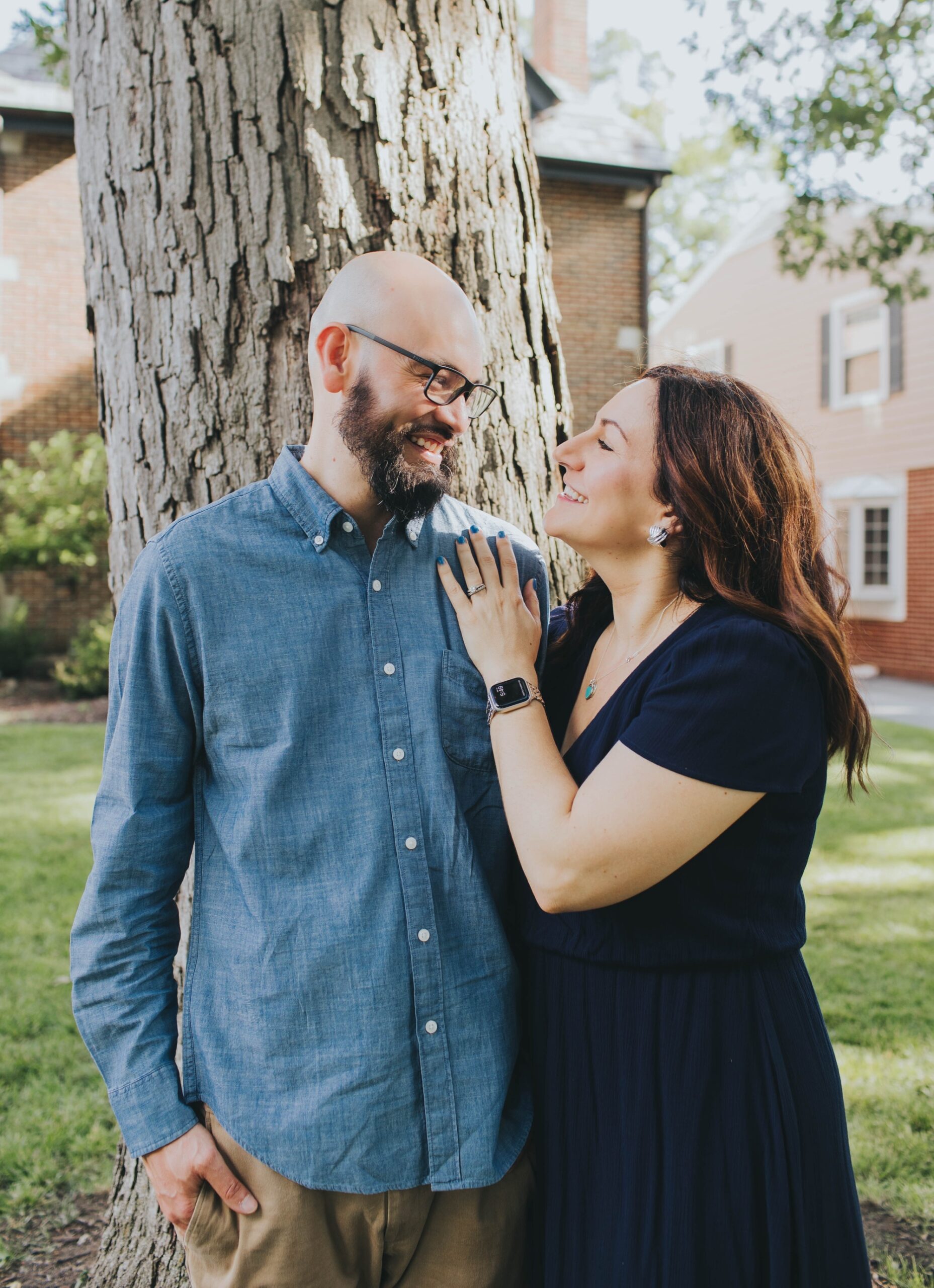 Parents taking photos together during family photoshoot