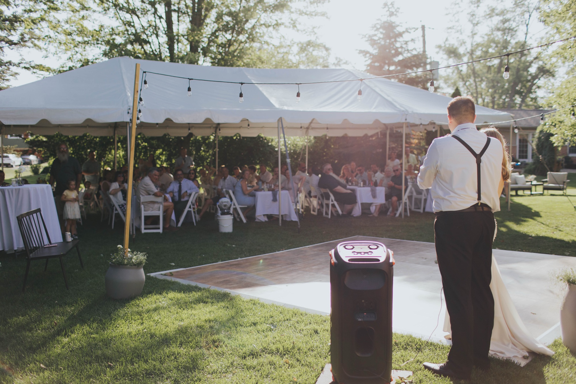 outdoor wedding toasts; tent for backyard wedding Chicago