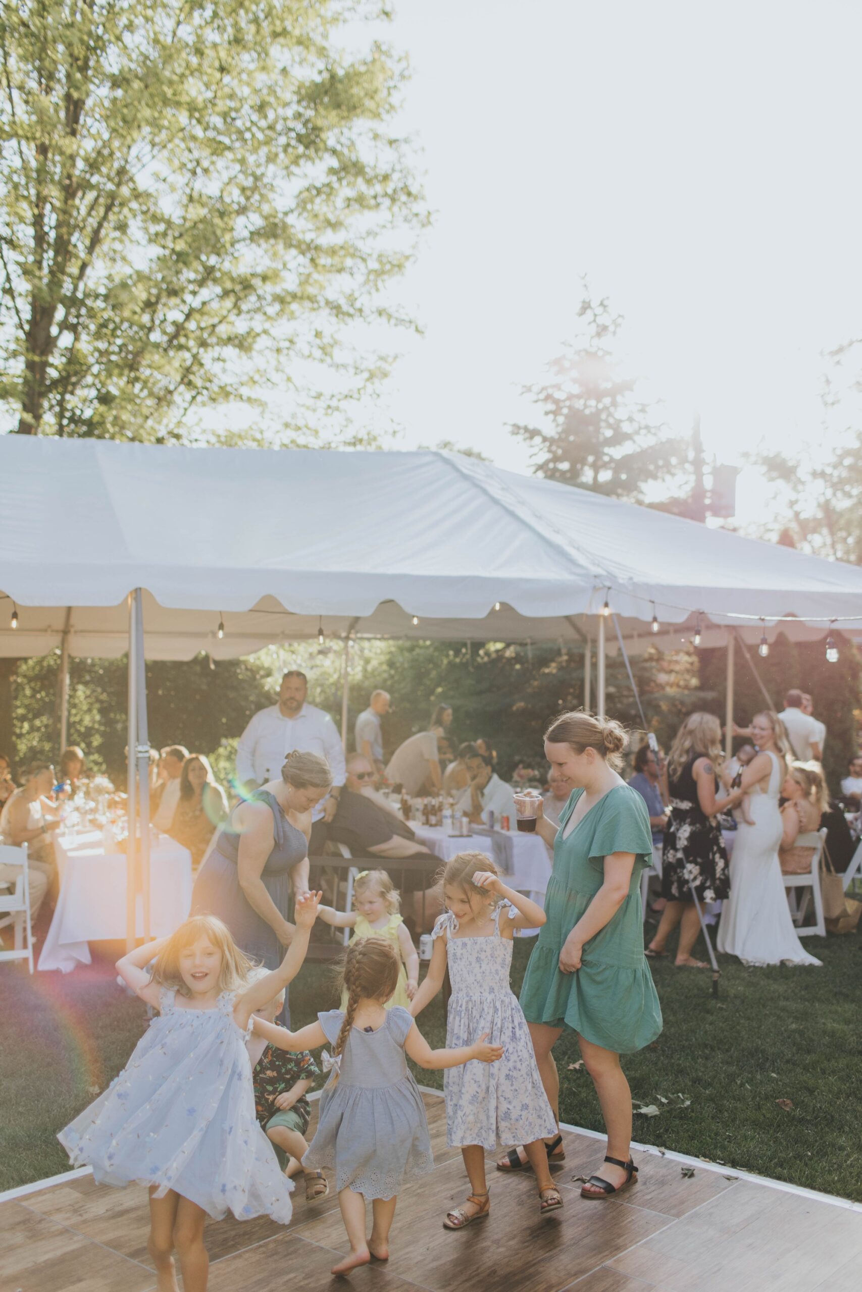 kids dancing at backyard wedding reception in Oak Forest