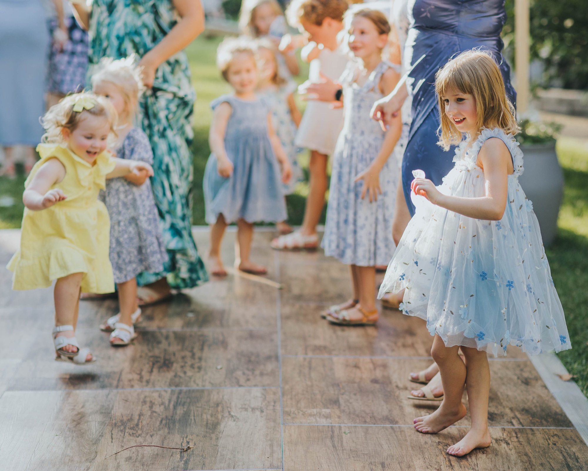 little girls dancing at wedding